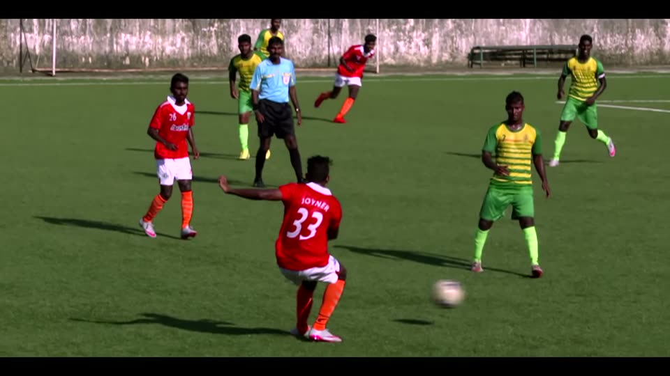 A striker takes a shot during a football match in Kolkata